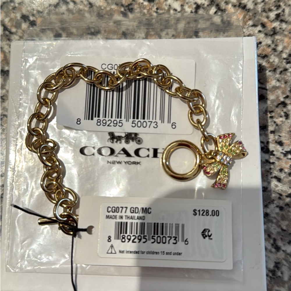 Coach Gold Bracelet with Multicolor Gem Encrusted Bow Charm New in Box - Picture 4 of 7